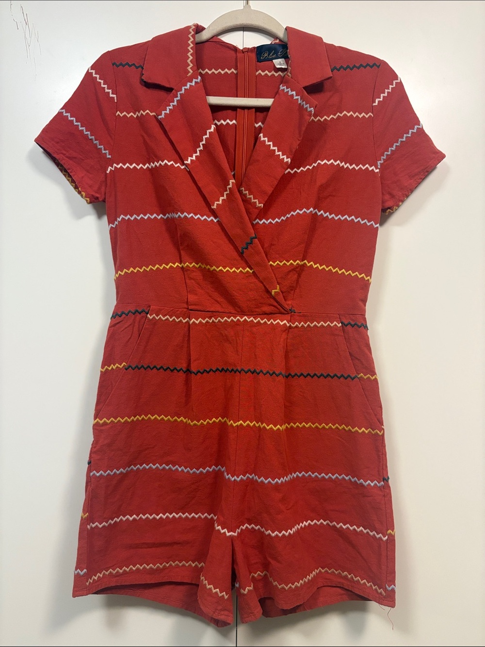 Blue Rain burnt orange shirt romper featuring embroidered zigzag stripes S